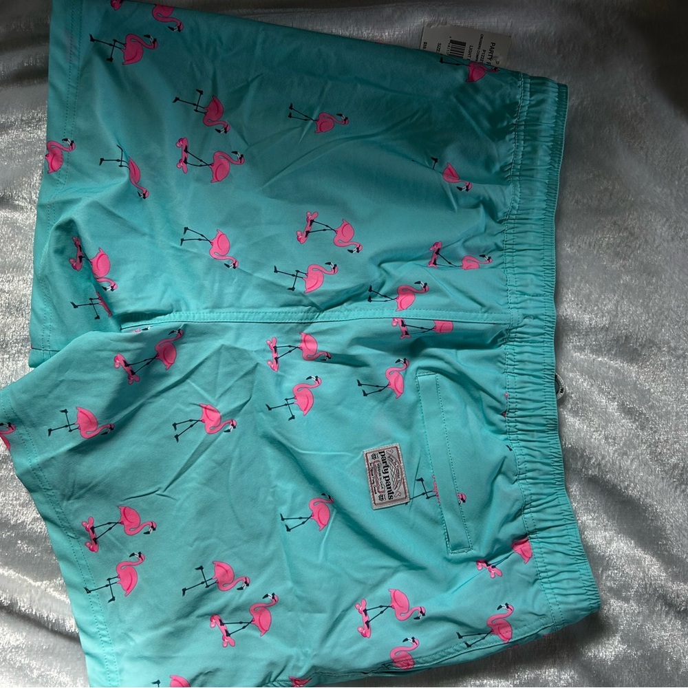 Men’s flamingo bathing suit- never worn.  Inside has compression shorts.
